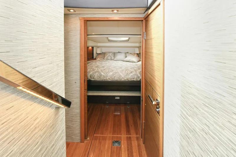 Slide: The Image of 2018 Tiara Yachts 39 Coupe interior cabin with bed, wooden flooring, and modern design. - 32