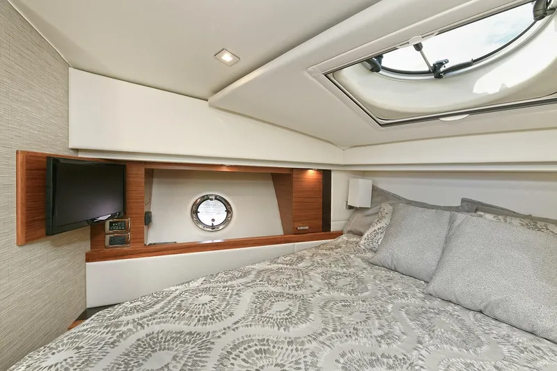 Slide: The Image of Luxurious cabin interior of 2018 Tiara Yachts 39 Coupe with skylight and cozy bedding. - 36