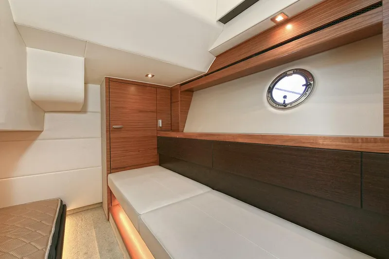 Slide: The Image of 2018 Tiara Yachts 39 Coupe interior with sleek wood finish and modern design. - 41