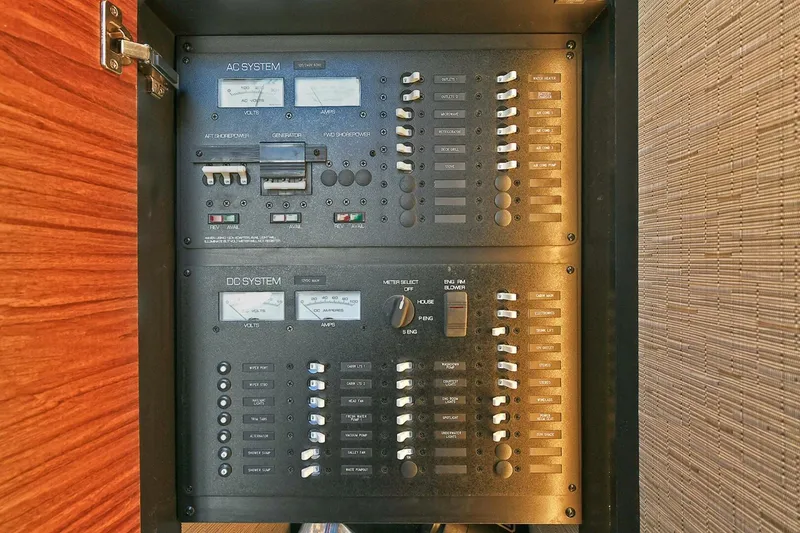 Slide: The Image of Electrical panel of 2018 Tiara Yachts 39 Coupe, featuring AC and DC systems. - 43