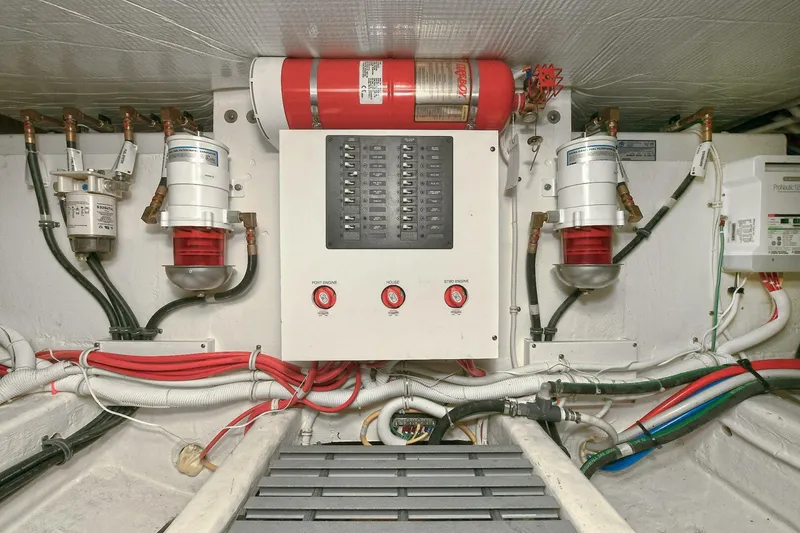 Slide: The Image of Engine room of 2018 Tiara Yachts 39 Coupe with fire suppression system and wiring. - 49