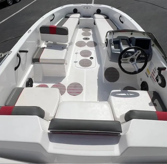 Slide: The Image of 2023 Tahoe T18 boat interior with seating, steering wheel, and modern design elements. - 6