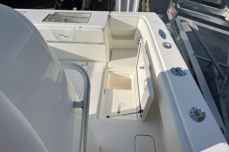 Slide: The Image of 2018 SeaVee 320B boat interior with open storage compartment and sleek design. - 10