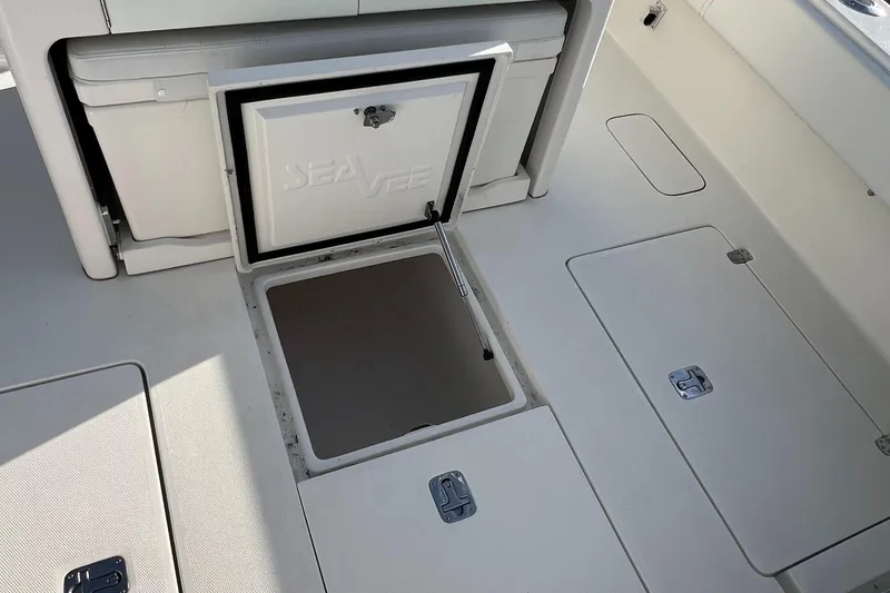 Slide: The Image of 2018 SeaVee 320B boat deck with storage compartments open. - 11