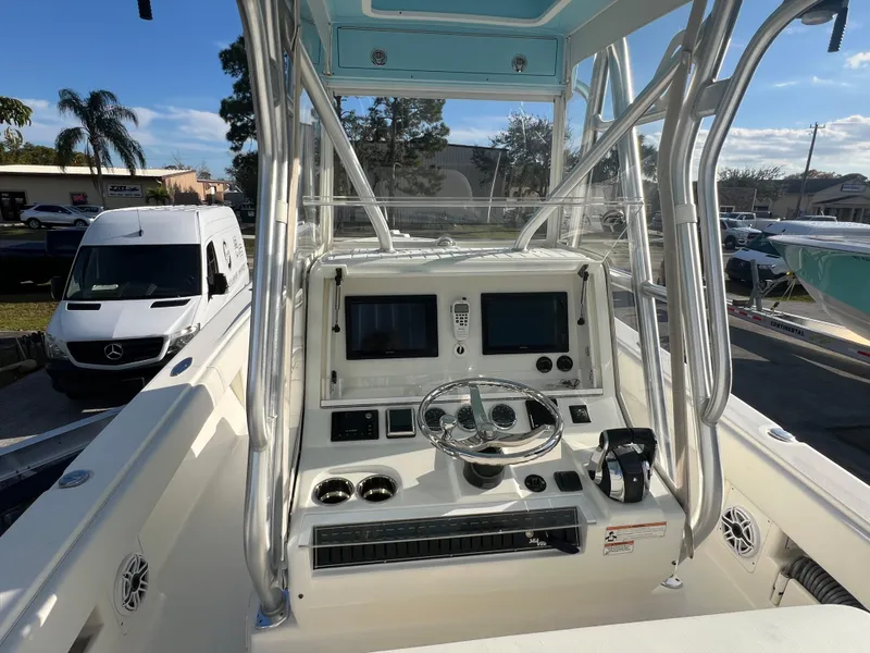 Slide: The Image of 2018 SeaVee 320B boat console with dual screens and steering wheel. - 7