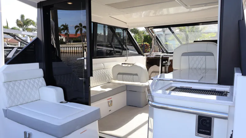 Slide: The Image of 2023 Regal 36 XO yacht interior with luxurious seating and modern design. - 15