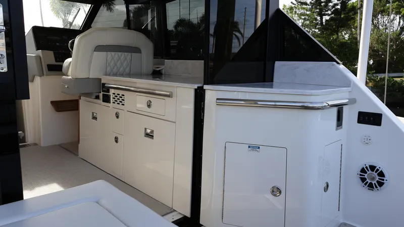 Slide: The Image of 2023 Regal 36 XO yacht interior with sleek cabinetry and modern design elements. - 17