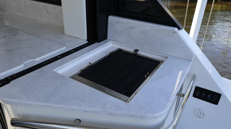Slide: The Image of 2023 Regal 36 XO yacht grill area with sleek countertop design. - 19