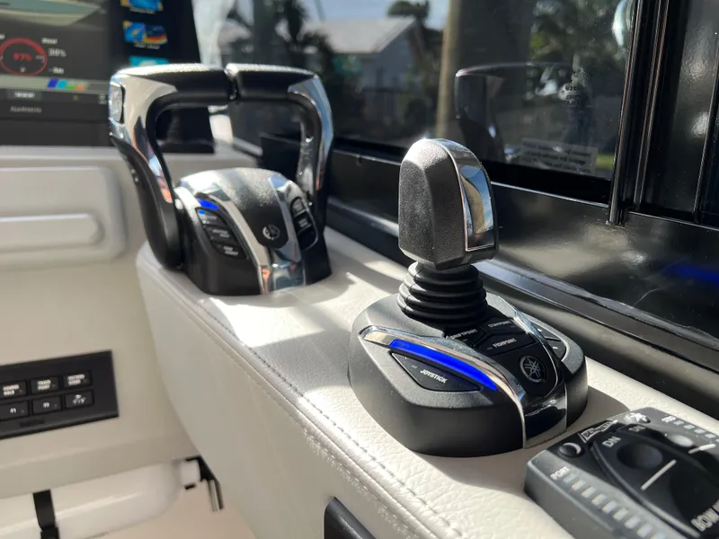 Slide: The Image of Control panel of 2023 Regal 36 XO boat with joystick and throttle. - 34