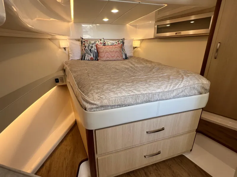 Slide: The Image of Luxurious cabin interior of 2023 Regal 36 XO yacht with cozy bed and modern design. - 38