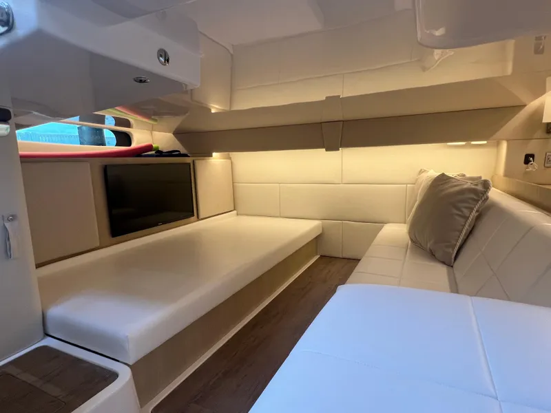 Slide: The Image of 2023 Regal 36 XO interior cabin with modern seating and ambient lighting. - 41
