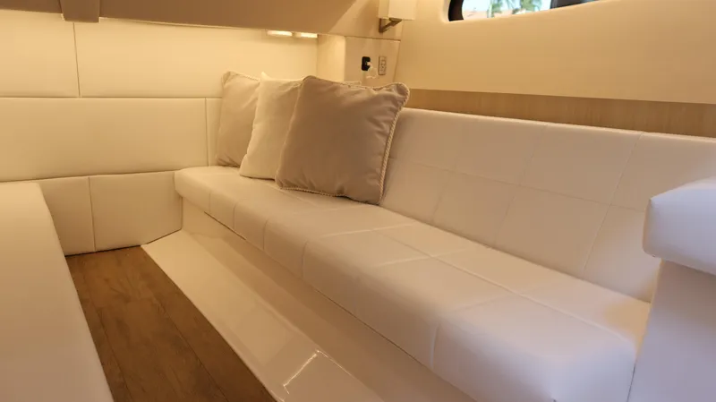 Slide: The Image of Luxurious interior of 2023 Regal 36 XO yacht with white seating and cushions. - 43