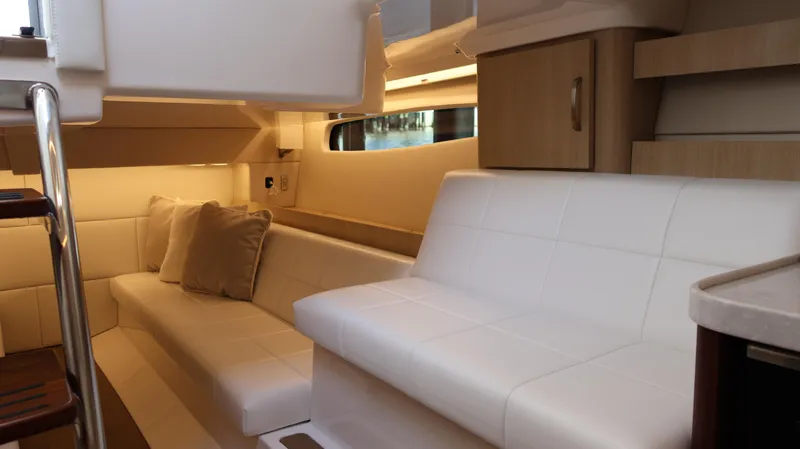 Slide: The Image of Luxurious interior of 2023 Regal 36 XO yacht with white seating and wooden accents. - 45