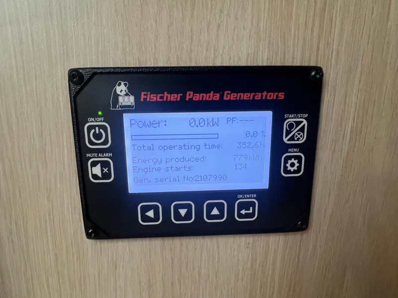 Slide: The Image of Control panel of Fischer Panda Generators on 2023 Regal 36 XO boat. - 50