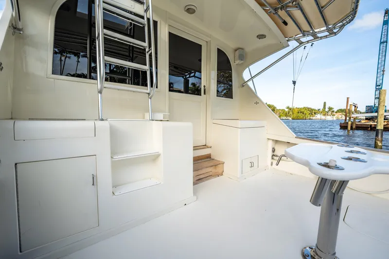 Slide: The Image of 1989 Post 43 Convertible yacht deck with ladder and waterfront view. - 18