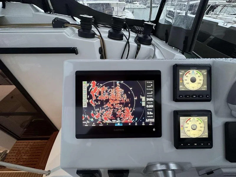Slide: The Image of Control panel of 2025 Fountaine Pajot Astrea 42 with navigation screens. - 27