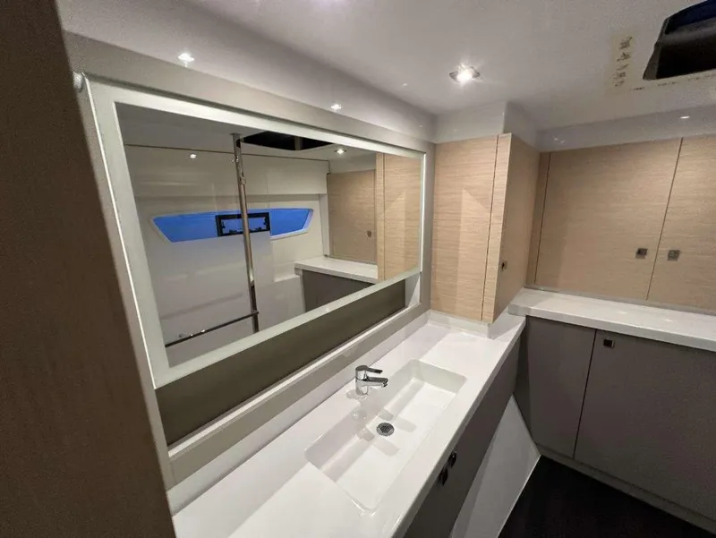 Slide: The Image of Modern bathroom interior of 2025 Fountaine Pajot Astrea 42 yacht, featuring sleek design and fixtures. - 29