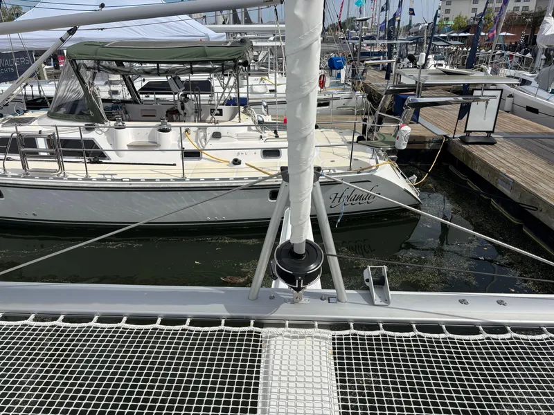 Slide: The Image of 2025 Fountaine Pajot Astrea 42 catamaran docked at marina, showcasing deck and rigging. - 32