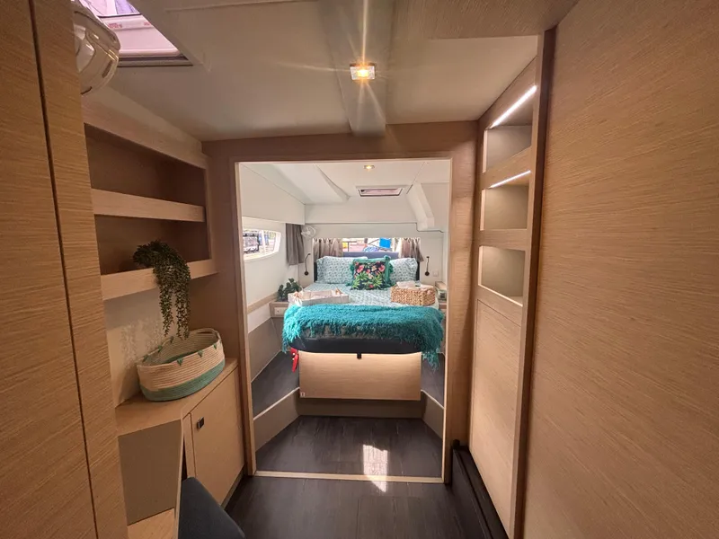 Slide: The Image of Luxurious interior of 2025 Fountaine Pajot Astrea 42 catamaran, featuring a cozy bedroom. - 2