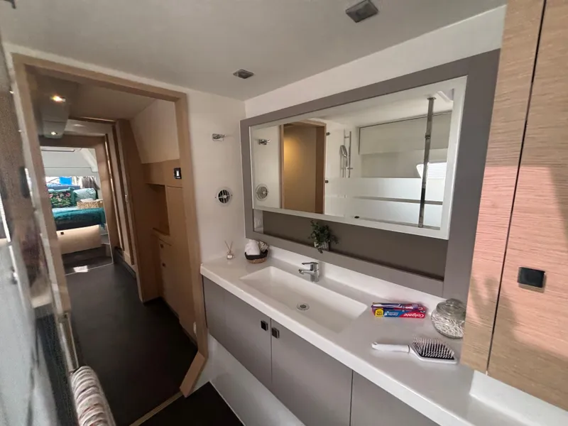Slide: The Image of Modern bathroom interior of 2025 Fountaine Pajot Astrea 42 catamaran, featuring sleek design elements. - 22