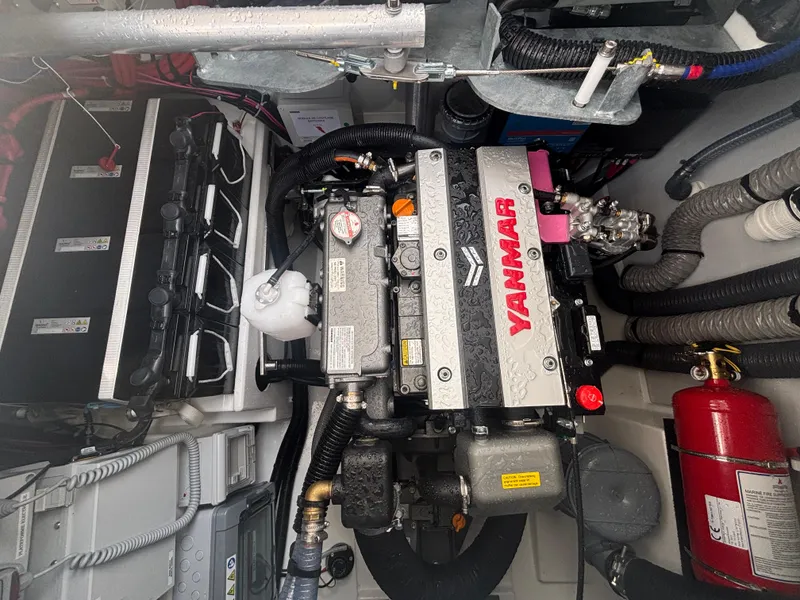 Slide: The Image of Engine compartment of 2025 Fountaine Pajot Astrea 42 with Yanmar engine and fire extinguisher. - 37