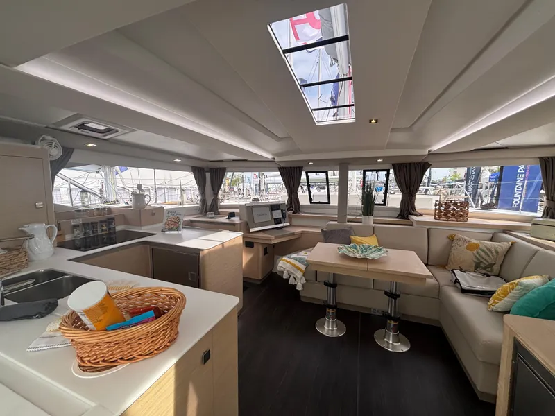 Slide: The Image of Luxurious interior of 2025 Fountaine Pajot Astrea 42 catamaran with modern furnishings and ample natural light. - 8