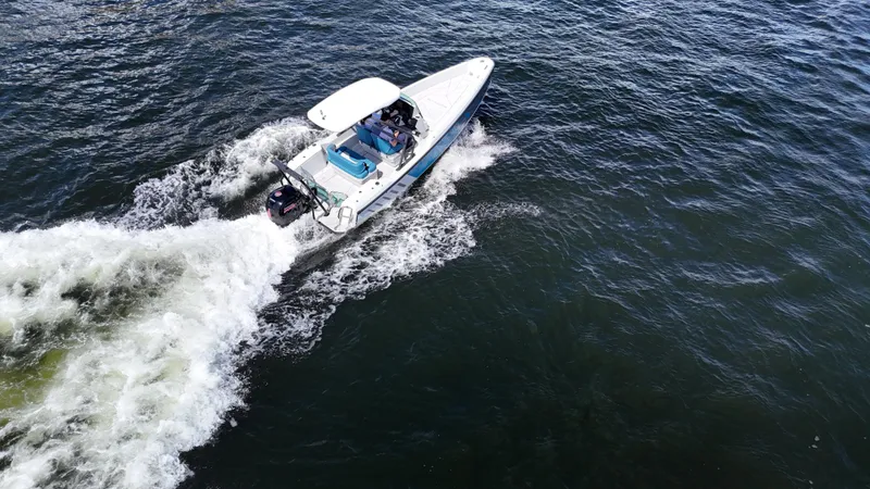 The Image of 2022 Saxdor SX200 boat cruising on open water, aerial view. - 0