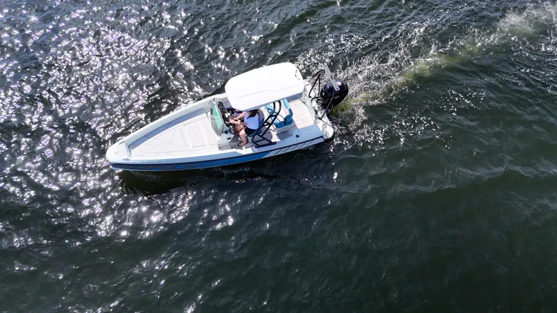 Slide: The Image of 2022 Saxdor SX200 boat cruising on sparkling water, aerial view. - 5