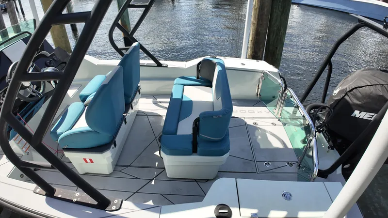 Slide: The Image of 2022 Saxdor SX200 boat interior with blue seating and modern design. - 7