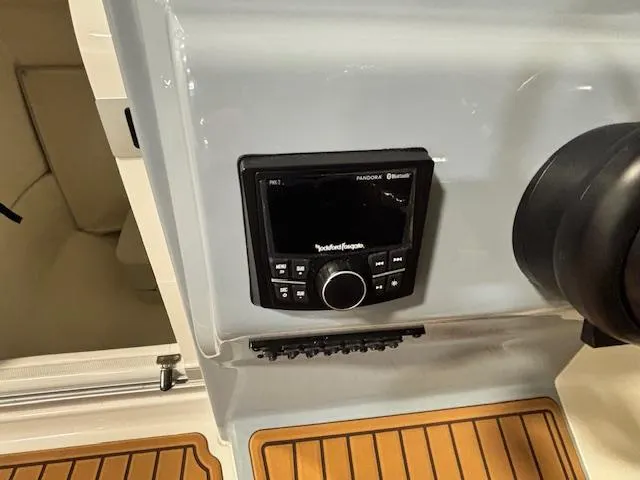 Slide: The Image of Control panel on 2025 Bayliner T22 SC boat with Rockford Fosgate audio system. - 20