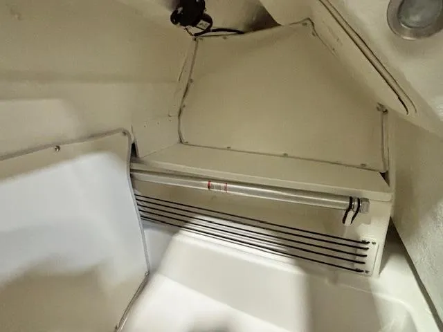 Slide: The Image of 2025 Bayliner T22 SC interior storage compartment, featuring a sleek, compact design. - 23