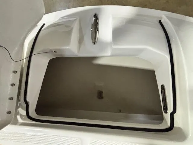 Slide: The Image of 2025 Bayliner T22 SC storage compartment with open hatch, showcasing interior space. - 29