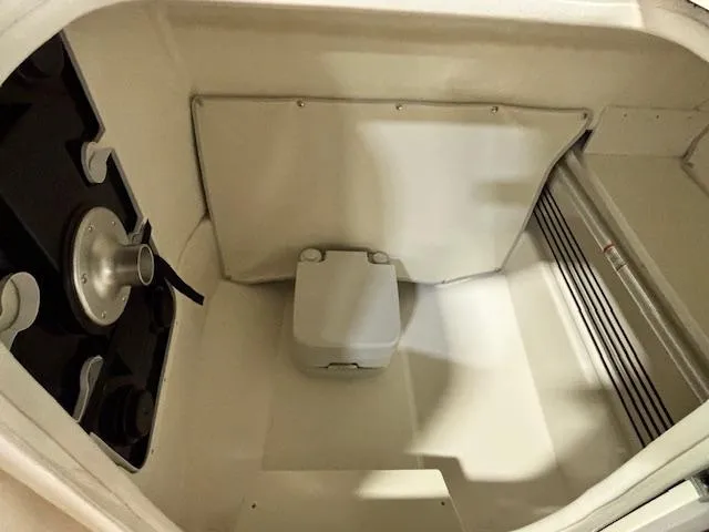 Slide: The Image of Interior of 2025 Bayliner T22 SC boat, featuring compact storage space. - 21