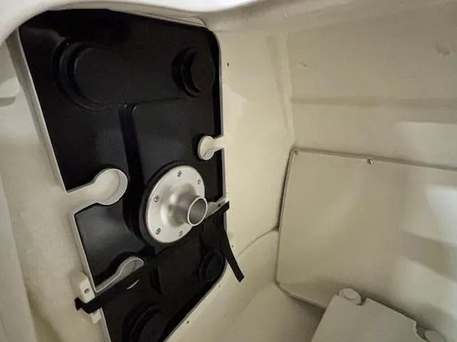 Slide: The Image of 2025 Bayliner T22 SC interior compartment with black and white components. - 22