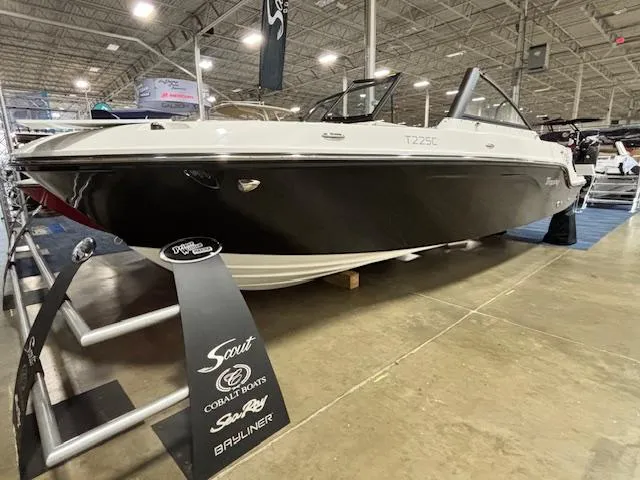 Slide: The Image of 2025 Bayliner T22 SC boat displayed indoors at a showroom. - 4