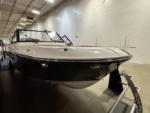 Slide: The Image of 2025 Bayliner T22 SC boat displayed indoors, showcasing sleek design and modern features. - 5