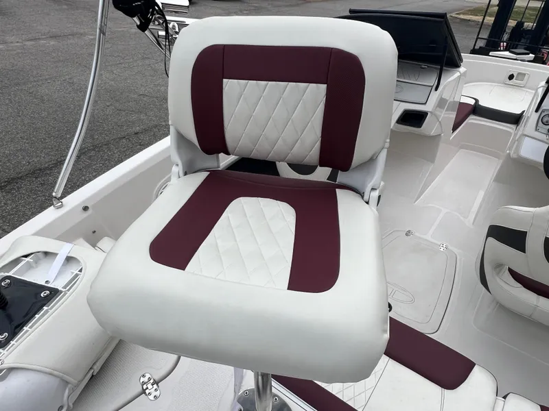 Slide: The Image of 2016 Tahoe 450 TF boat seat with white and maroon upholstery. - 13
