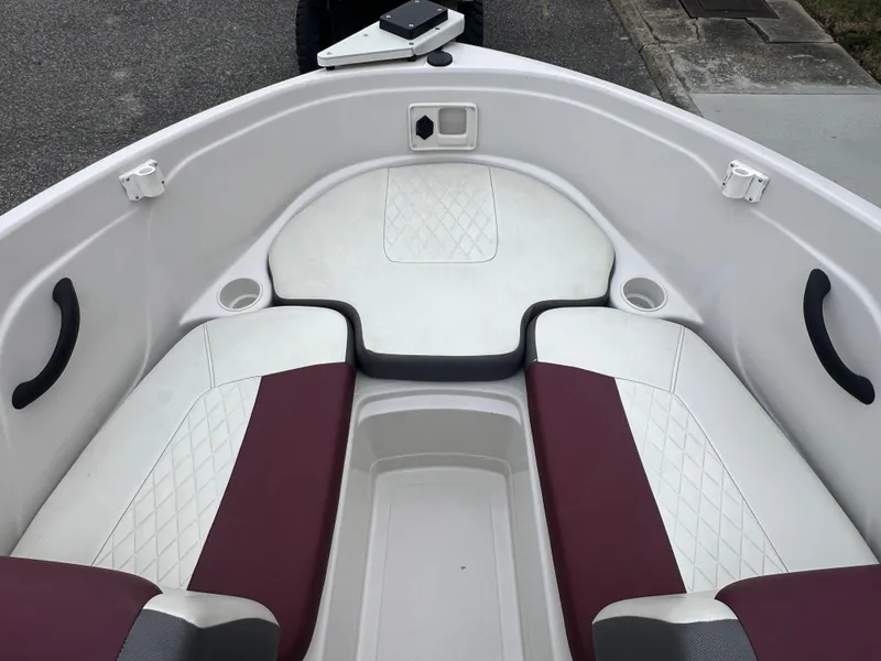 Slide: The Image of 2016 Tahoe 450 TF boat interior with white and maroon seating. - 14