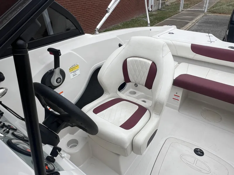 Slide: The Image of 2016 Tahoe 450 TF boat interior with white and maroon seating. - 18