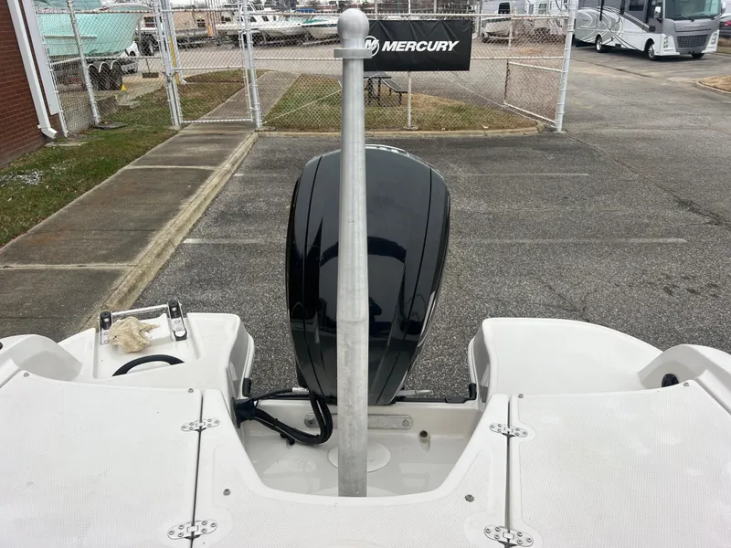 Slide: The Image of 2016 Tahoe 450 TF boat with Mercury engine, parked in a lot. - 31