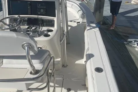 Slide: The Image of 2008 Boston Whaler 270 Outrage boat interior with steering console and seating. - 12