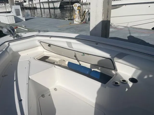 Slide: The Image of 2008 Boston Whaler 270 Outrage boat interior with open storage compartment. - 15