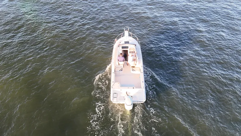 Slide: The Image of Aerial view of 1996 Grady-White Voyager boat cruising on open water. - 2