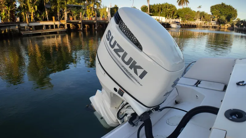 Slide: The Image of 1996 Grady-White Voyager with Suzuki outboard motor on calm water. - 7