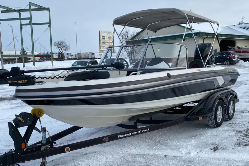 Slide: The Image of 2008 Ranger 2050VS boat on trailer, parked in snowy outdoor setting. - 4