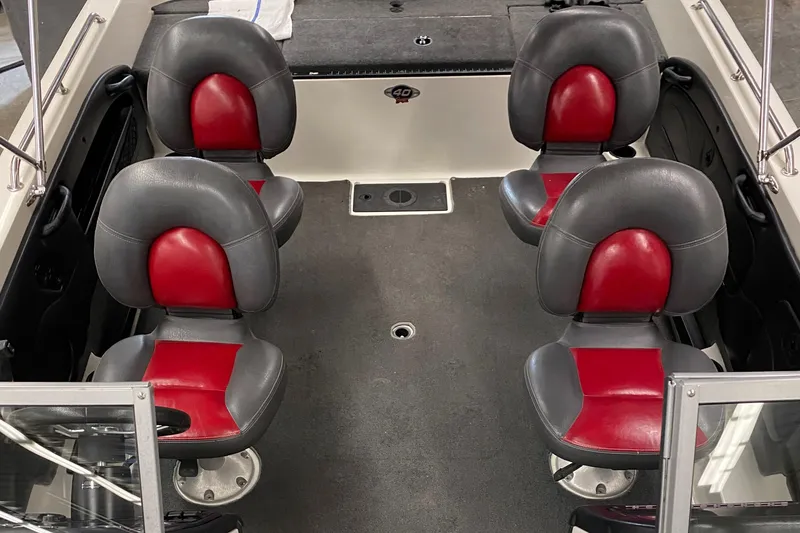 Slide: The Image of 2008 Ranger 2050VS boat interior with four red and black seats. - 5