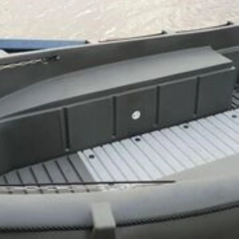 Slide: The Image of 2023 Whaly 455 R boat interior with gray seating and flooring. - 6
