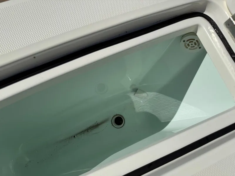 Slide: The Image of Livewell compartment on a 2019 Regulator 31 boat, featuring a clean interior. - 10