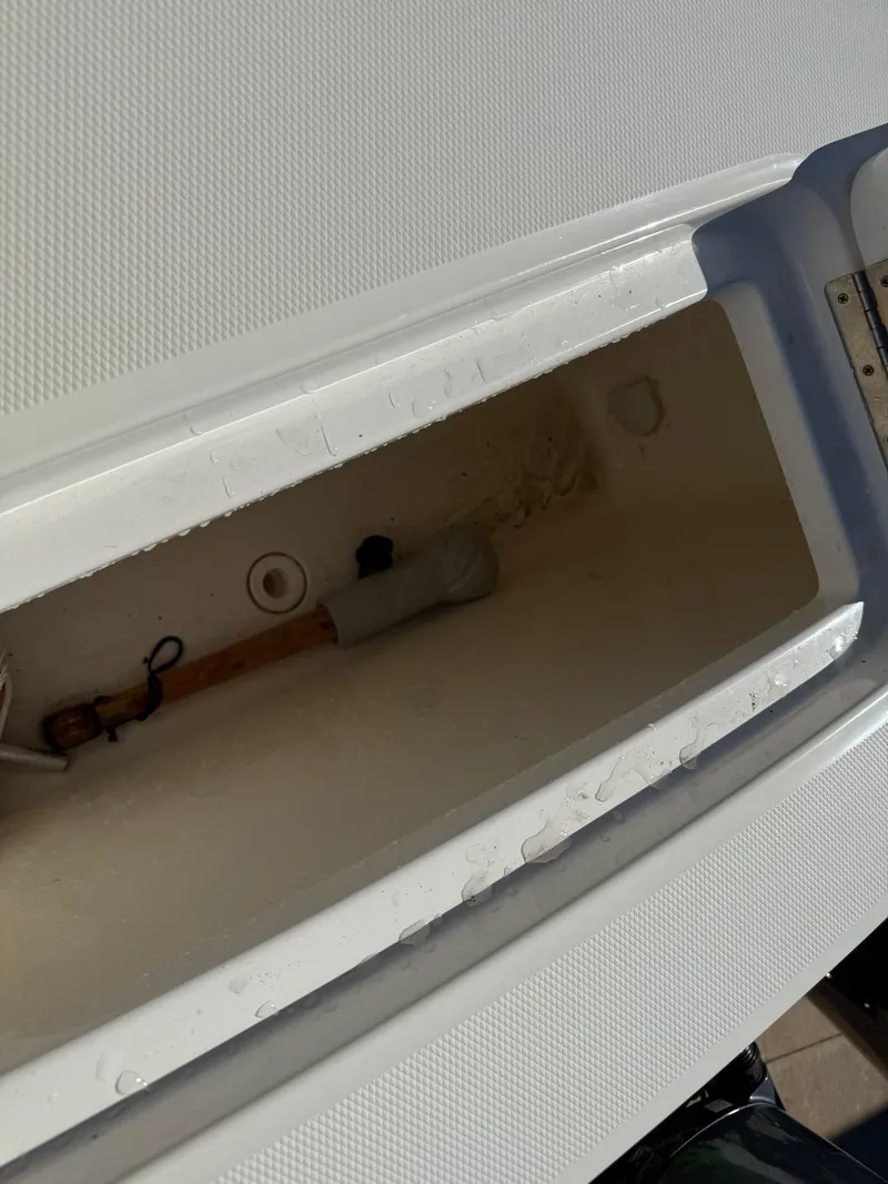 Slide: The Image of Storage compartment of a 2019 Regulator 31 boat, showing interior details. - 11
