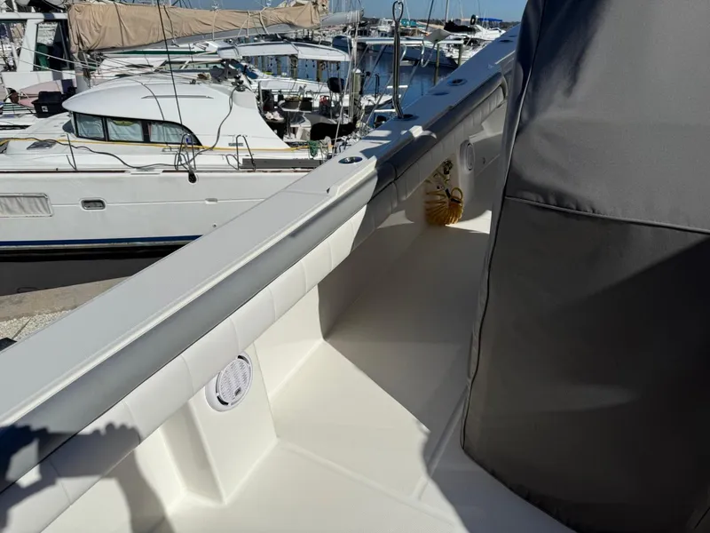 Slide: The Image of 2019 Regulator 31 boat deck with marina view in the background. - 13